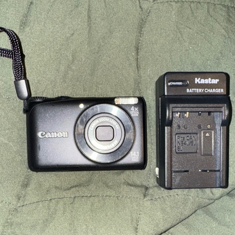 Canon Black Digital Camera with Kastar Battery Charger